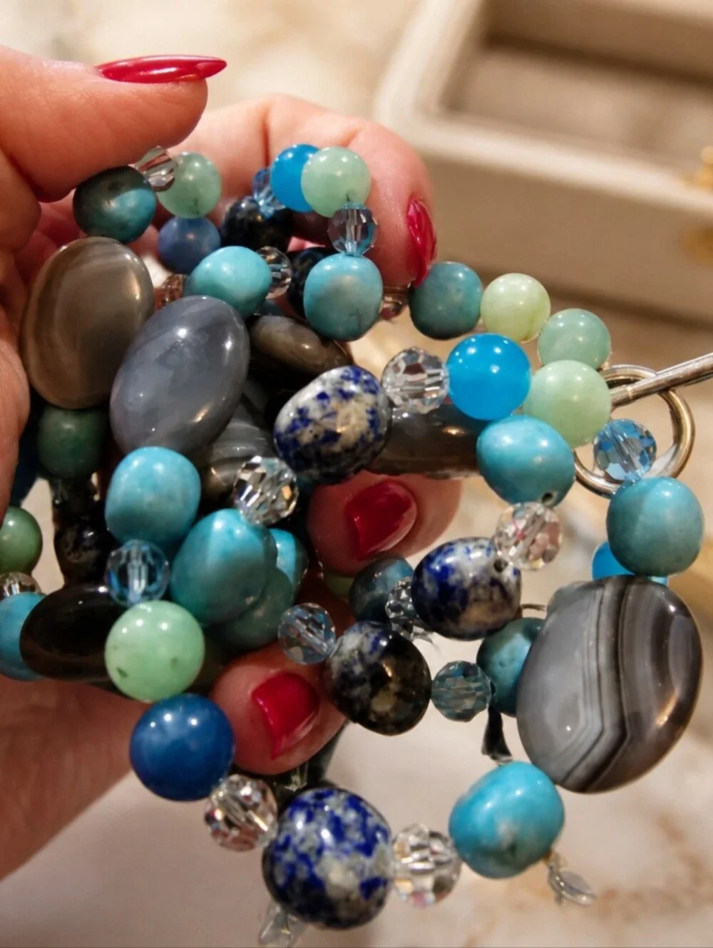 This is a mixed gemstone and glass bead statement necklace